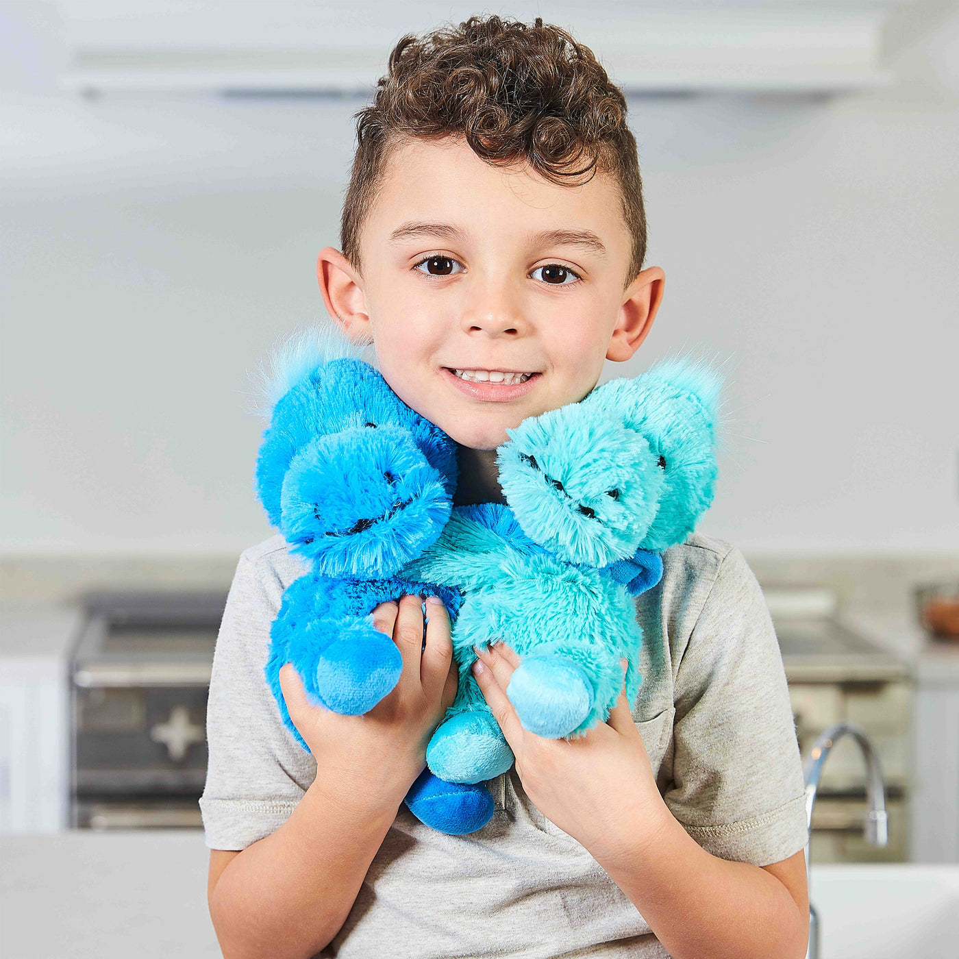 Warmies® Fully Microwaveable Warm Hugs Dinosaurs, Heatable Soft Cuddly Teddy With Relaxing Lavender Scent